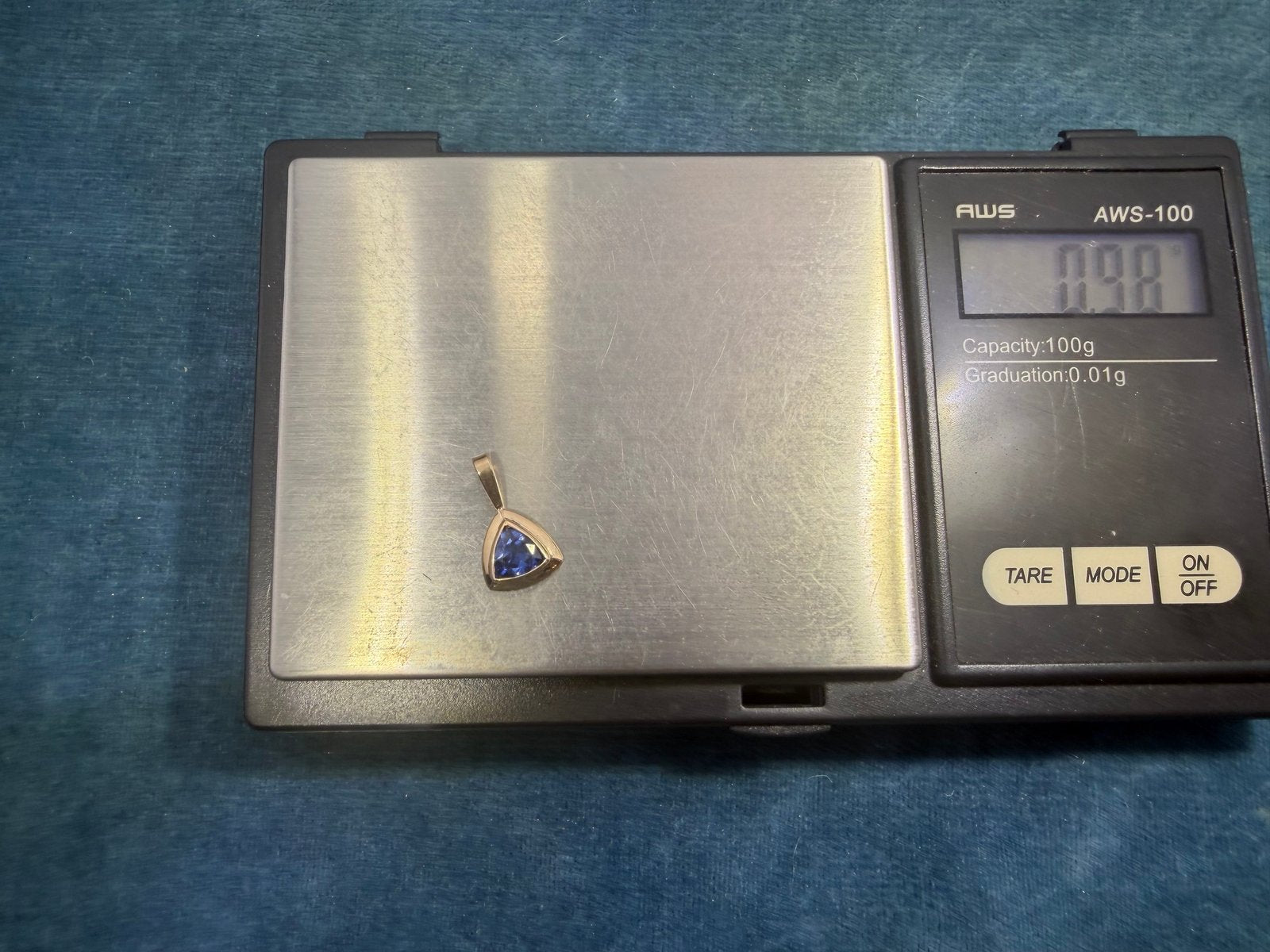 14k Yellow Gold Blue Lab-Created Sapphire Pendant. Trillion Bezel