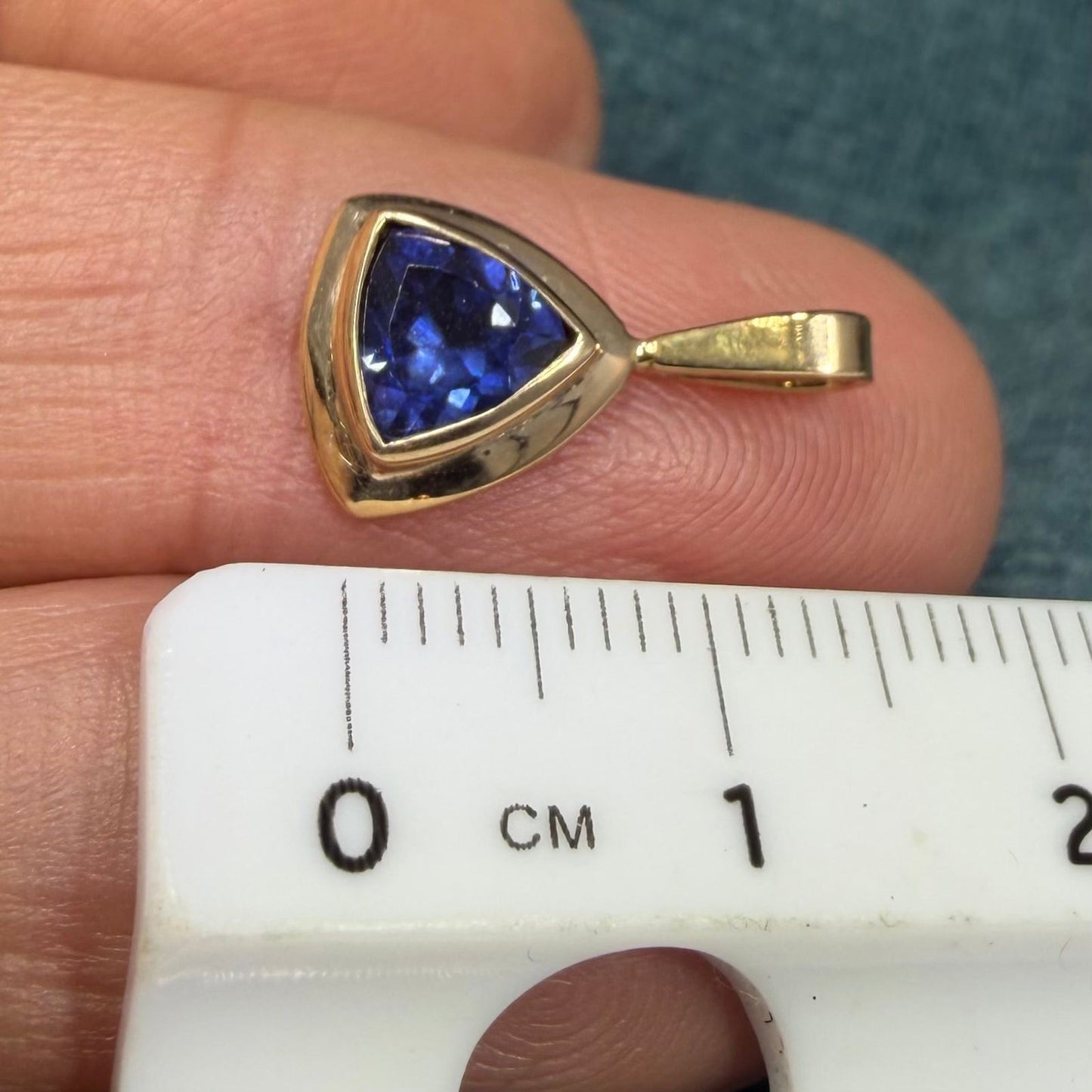 14k Yellow Gold Blue Lab-Created Sapphire Pendant. Trillion Bezel