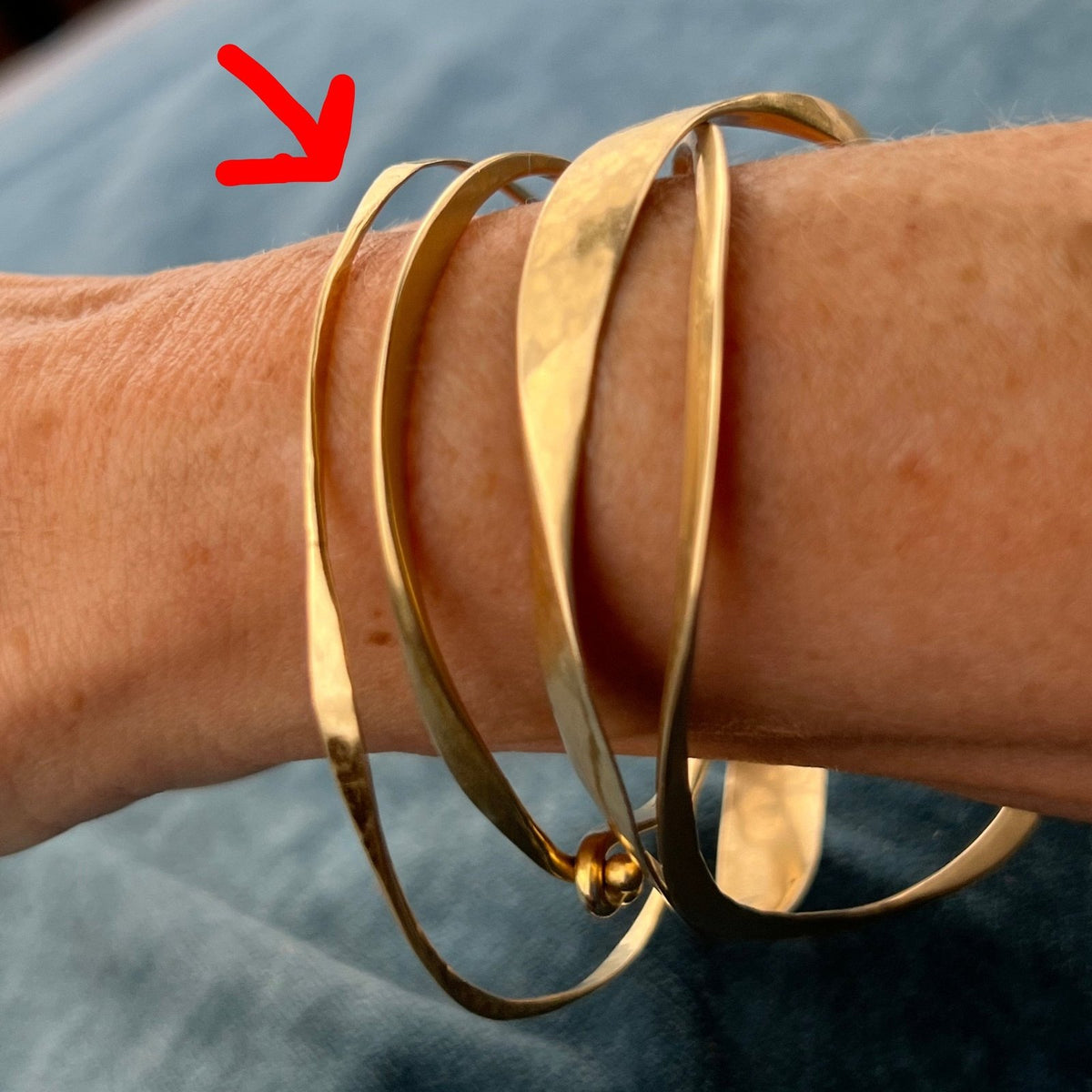 14k Yellow Gold Hammered Twisted Bangle Bracelet. Designer