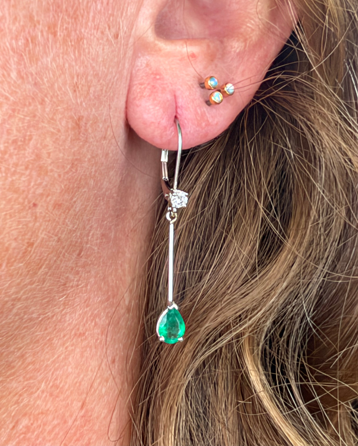 14k White Gold Dangle Earrings w Teardrop Emeralds + Diamonds. Leverback