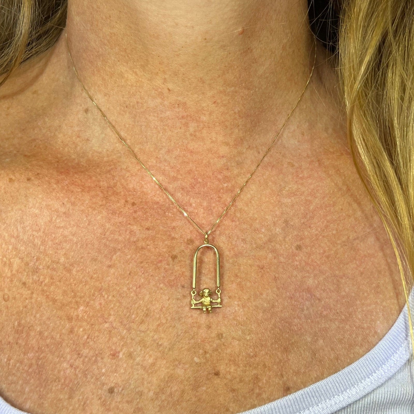 Girl on a swing necklace deals
