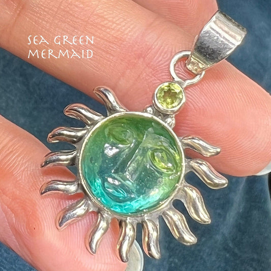 Carved Blue Green Quartz Man in the Moon Sunburst Pendant